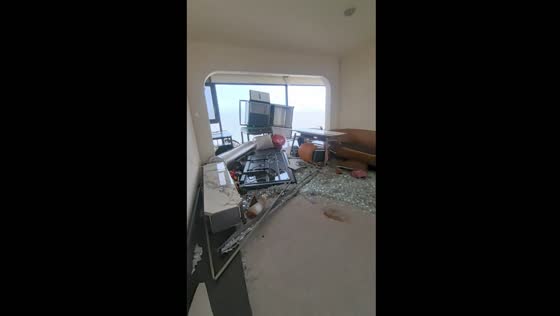 Typhoon Capricorn shatters windows and causes damage in Haikou home
