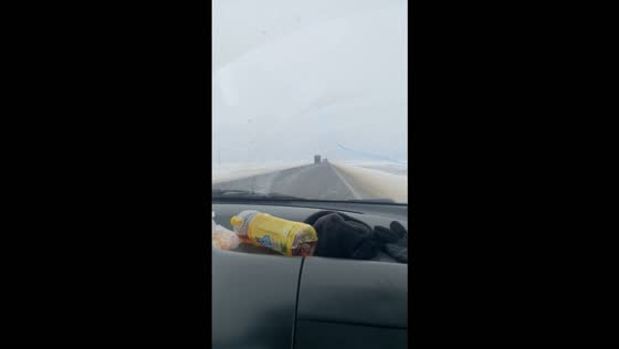 Car hood strikes and shatters a windshield on a misty highway in Atyrau, Kazakhstan