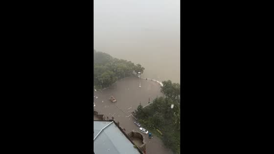 Heavy rain reduces visibility over plaza in Heilongjiang, China