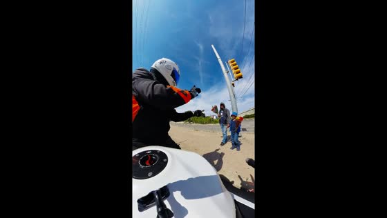 Biker buys red rose from street vendor in Austin