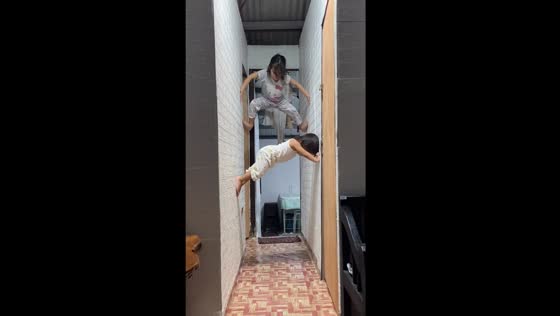 Two-year-old Jean Alexa climbs wall with sibling: impressive skills