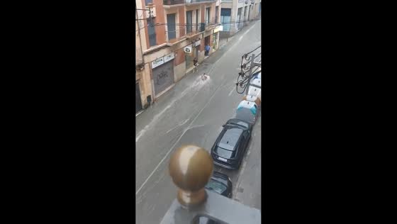 Man swept off his feet by powerful floodwater during storm in Tarragona, Spain