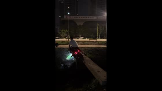 E-scooter rider falls while crossing wooden bridge in Sichuan, China