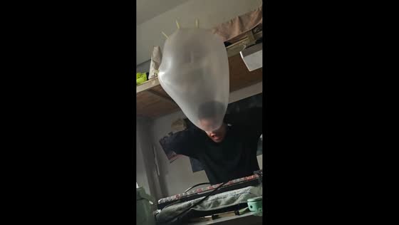 Man turns plastic glove into balloon in Liaoning, China