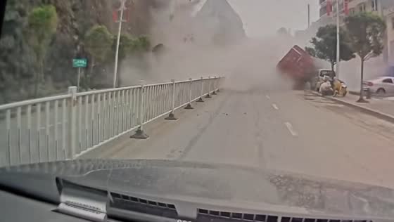 Landslide crashes onto road in Fengshan County during heavy rains in Guangxi, China 