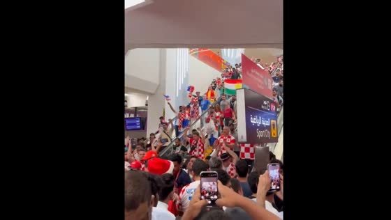 Croatian fans celebrate their team's victory after the match against Brazil