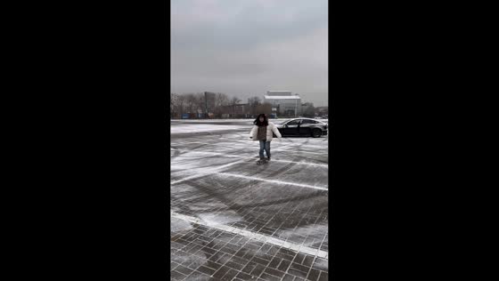 Unexpected skateboarding slip on ice in Beijing, China