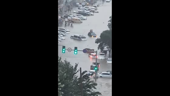 People stranded on flooded street in Liaoning, China