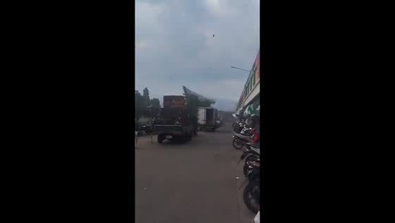 Severe weather sends roof flying and trees swaying in Soreang, Indonesia