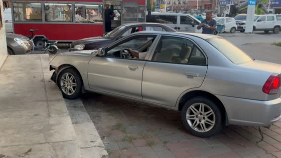 Driver overshoots parking attempt and bumps into concrete steps in Liaoning, China