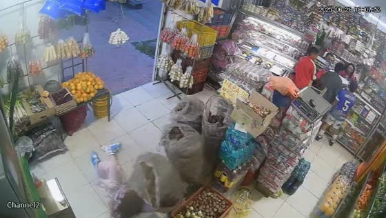 Girl in roller skates knocked over by sack of potatoes in Bogotá, Colombia