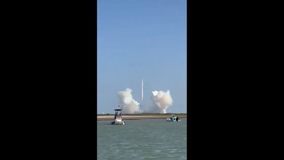 Spectators watch SpaceX's Starship launch from the waters off South Padre Island, USA