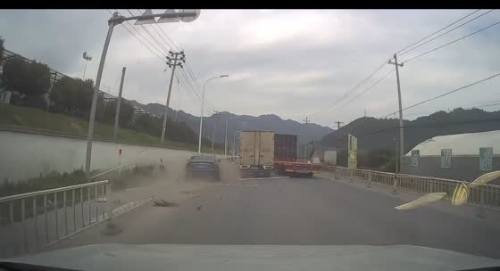 Cadillac crashes into barrier after failed overtake in Zhejiang, China