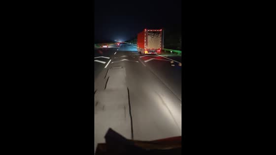 Truck loses cargo after rear door opens on highway in Hainan, China