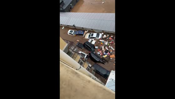 Intense flooding sweeps vehicles away in Beijing, China