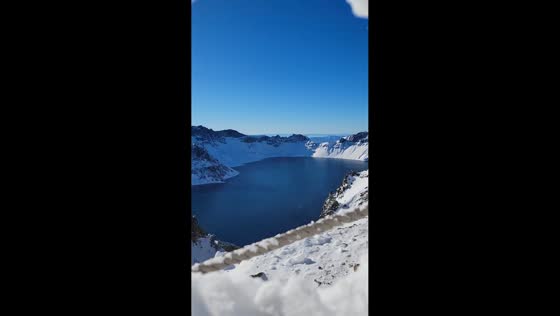  Beautiful view of Tianchi Lake revealed through snow in Jilin, China