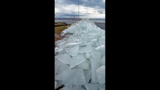 Massive ice boulders pile up along Oneida Lake shore in New York, USA
