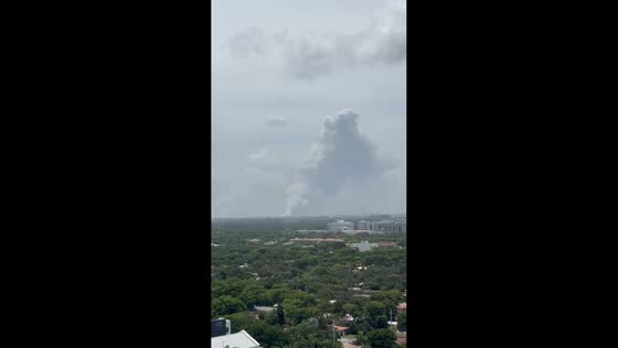 Massive wildfire smoke plume rises over skyline in Miami, Florida, USA