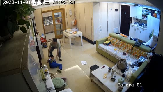 Son's playful mishap: a candid moment captured at home in Guangdong, China