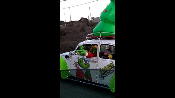 Grinch driving Christmas decorated car in Tijuana, Mexico
