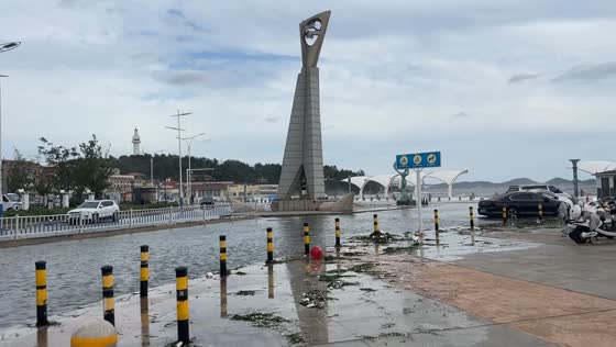 Powerful waves splash over seawall near Yantai Mountain Hospital in Shandong, China