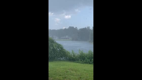 Sudden heavy rain and fierce winds by the lake in Jacksonville, Florida