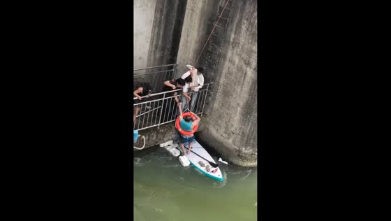 Father and daughter rescued from whirlpool near sluice gate in Sichuan, China