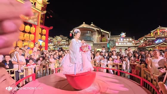 Tumbler girl street performance with perfect balancing in Shaanxi, China