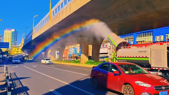 Mist cannon creates rainbow over street in Jiangxi, China