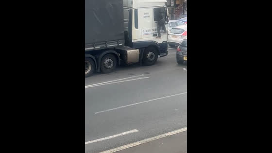 Confrontation erupts as sedan driver climbs truck to fight driver in Slough