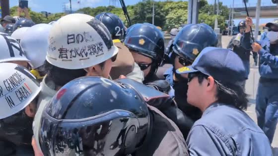 Protesters gather near Kadena Air Base in Okinawa, Japan 