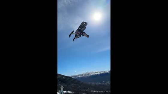 Snowmobile backflip attempt disrupted by strong winds in Oppdal, Norway