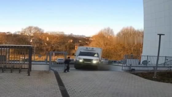 Truck flips onto rear wheels and crashes into gates in Kazan, Russia