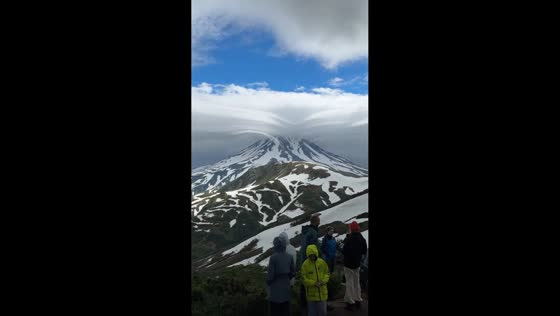 Rare lenticular cloud forms above volcano in Kamchatka Peninsula, Russia