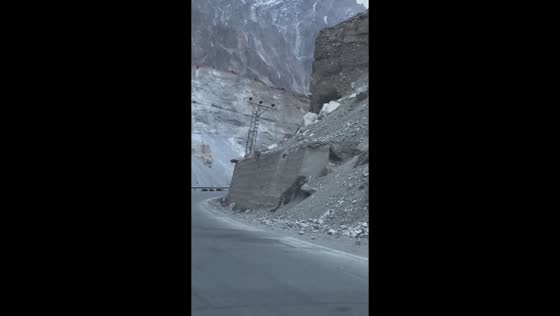 Snow leopard spotted blending into rocky mountains in Khyber, Gojal Hunza, Pakistan