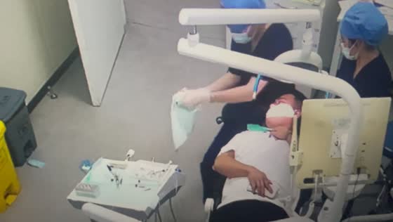 Security camera captures dental bib catching fire during procedure in Zhejiang, China