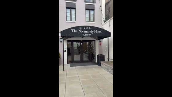 Light snow showers fall near The Normandy Hotel in Washington, D.C., USA