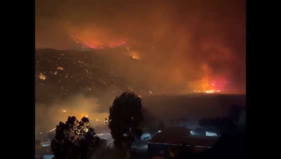 Night and morning after the wildfire in Malibu, California, USA