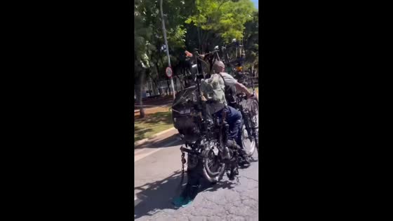 Man rides uniquely designed bicycle in São Paulo, Brazil