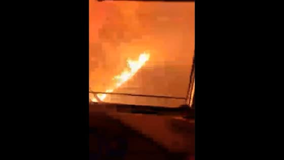 Train passes through burning Taiga amid ongoing forest fires in Buryatia