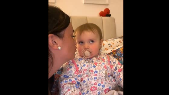 Toddler rolls eyes at mom for kiss attempt