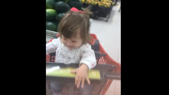 Cart with baby hits aisle during playful moment in Lima