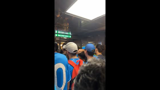 Fans chant in support of AC Milan at Garibaldi station in Milan, Italy