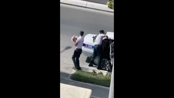 Law enforcement officer dismissed for rough handling of woman and child in Fergana, Uzbekistan