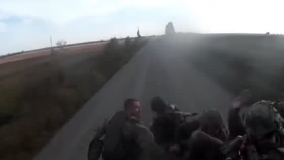 Russian military vehicle overturned on the move with soldiers during the retreat