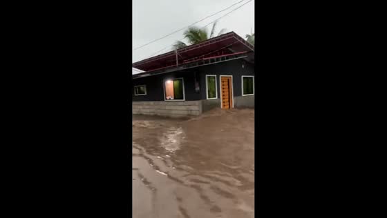 Strong flood sweeps through streets after heavy rain in Bansalan, Davao del Sur, Philippines