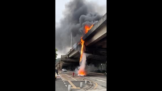 Overturned truck carrying flammable goods sparks dramatic fire under overpass in Guangdong, China
