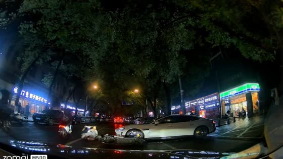 Motorcycle with passenger crashes into car in Jiangxi, China