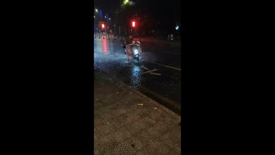 E-scooter rider slips on rain-soaked road in Zhejiang, China