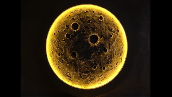 Artist creates cement moon with warm glow
